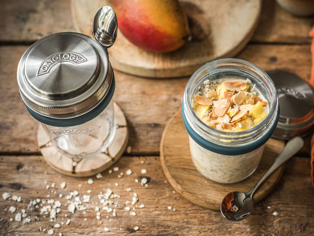 The OATOLOGY glass overnight oats jar with its stainless steel measuring lid and clip-on spoon