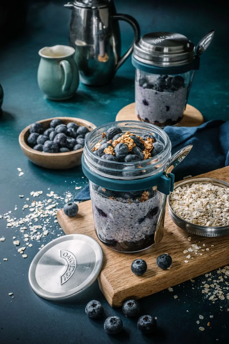 Spoonful lifted from the jar showing the thick, bit-free blended berry texture